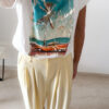 Pantalon femme jaune pastel taille haute à pinces avec t-shirt blanc imprimé palmier style Miami