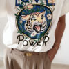 T-shirt femme blanc imprimé tigre Love is Power avec pantalon beige taille haute